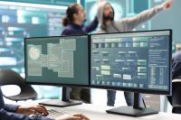Cyber security experts working on spyware and malware detection Cyber security experts working on spyware and malware detection in a governmental agency center. Examining server and database info on a big screen to combat cyberterrorism, hacking team.